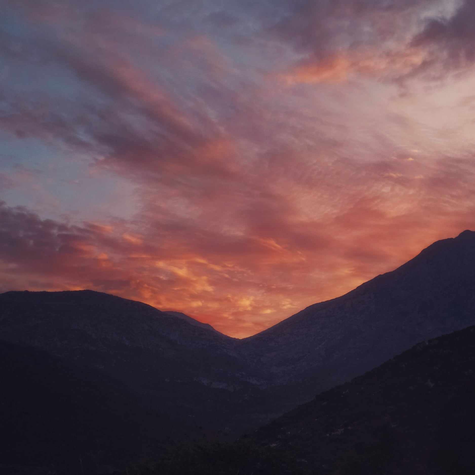 mountains under the the view of sunset